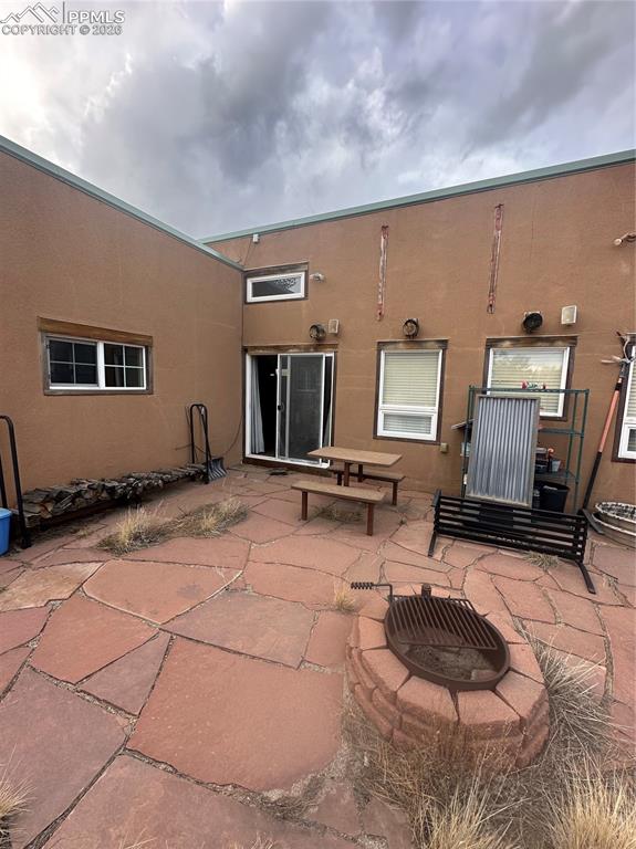 9086 Ranch Road Hartsel, CO 80449 - Photo 3 of 6 Back Patio with Fire Pit