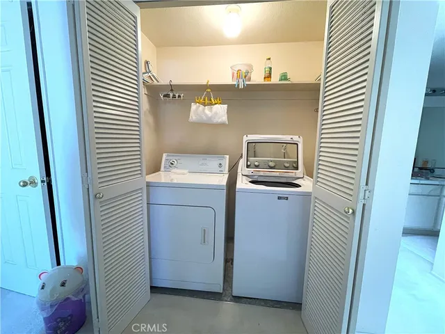 a utility room with washer and dryer