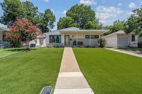 a front view of a house with yard