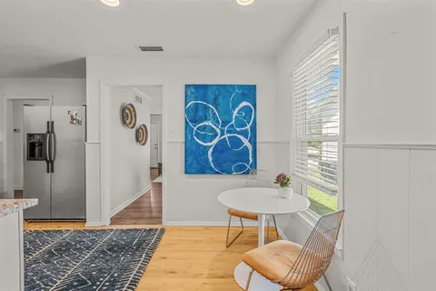 a view of a livingroom with furniture and wooden floor