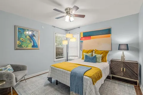 a bedroom with a bed and window