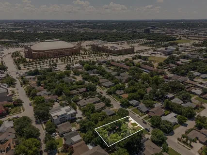 an aerial view of residential houses with city view