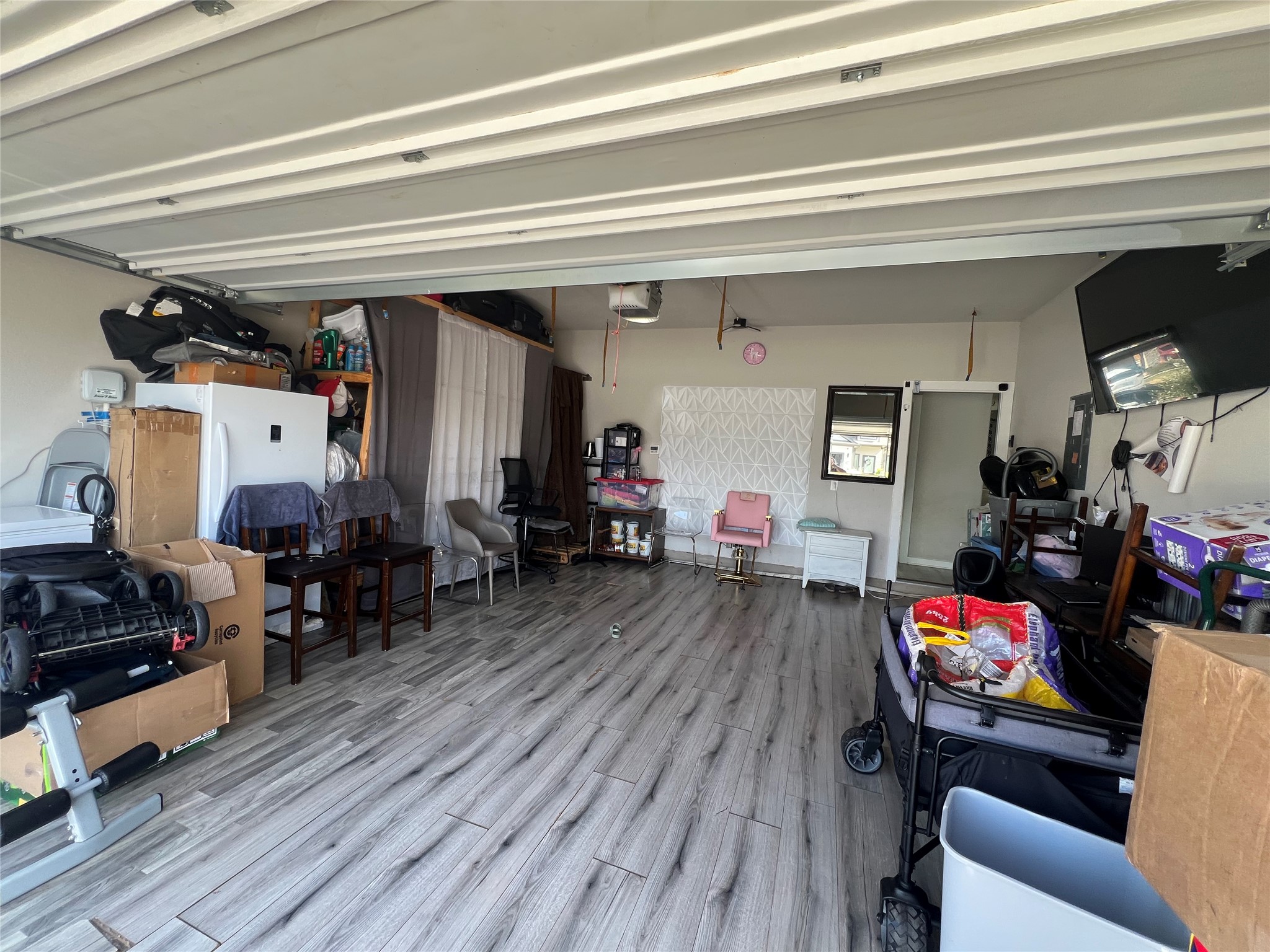 172 Coppers Way Elgin, TX 78621 - Photo 21 of 27 The garage has a mini split that’s been added to it and flooring converted it to a living area, but it could easily be converted back to a garage