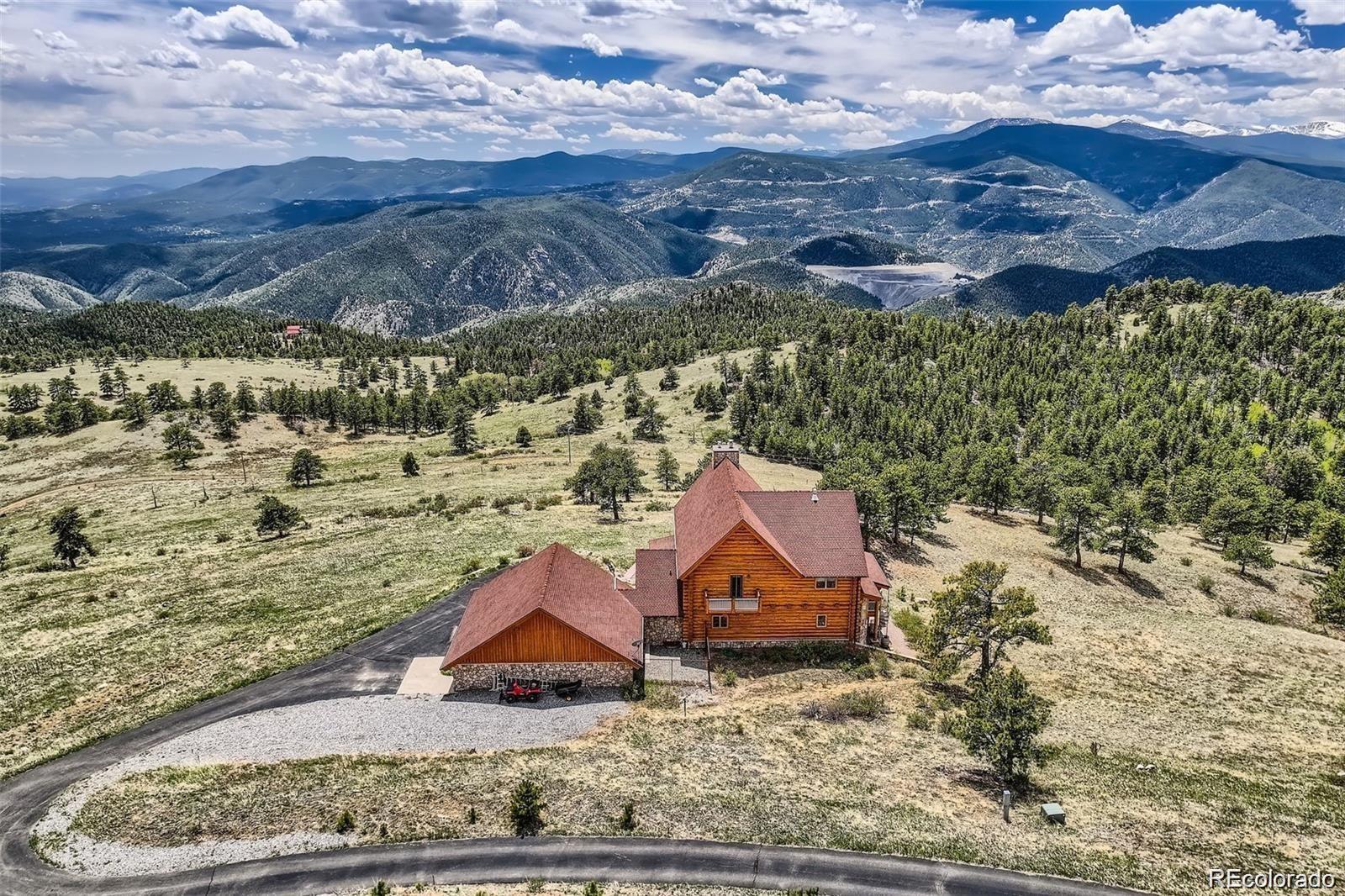 a aerial view of a house with a yard