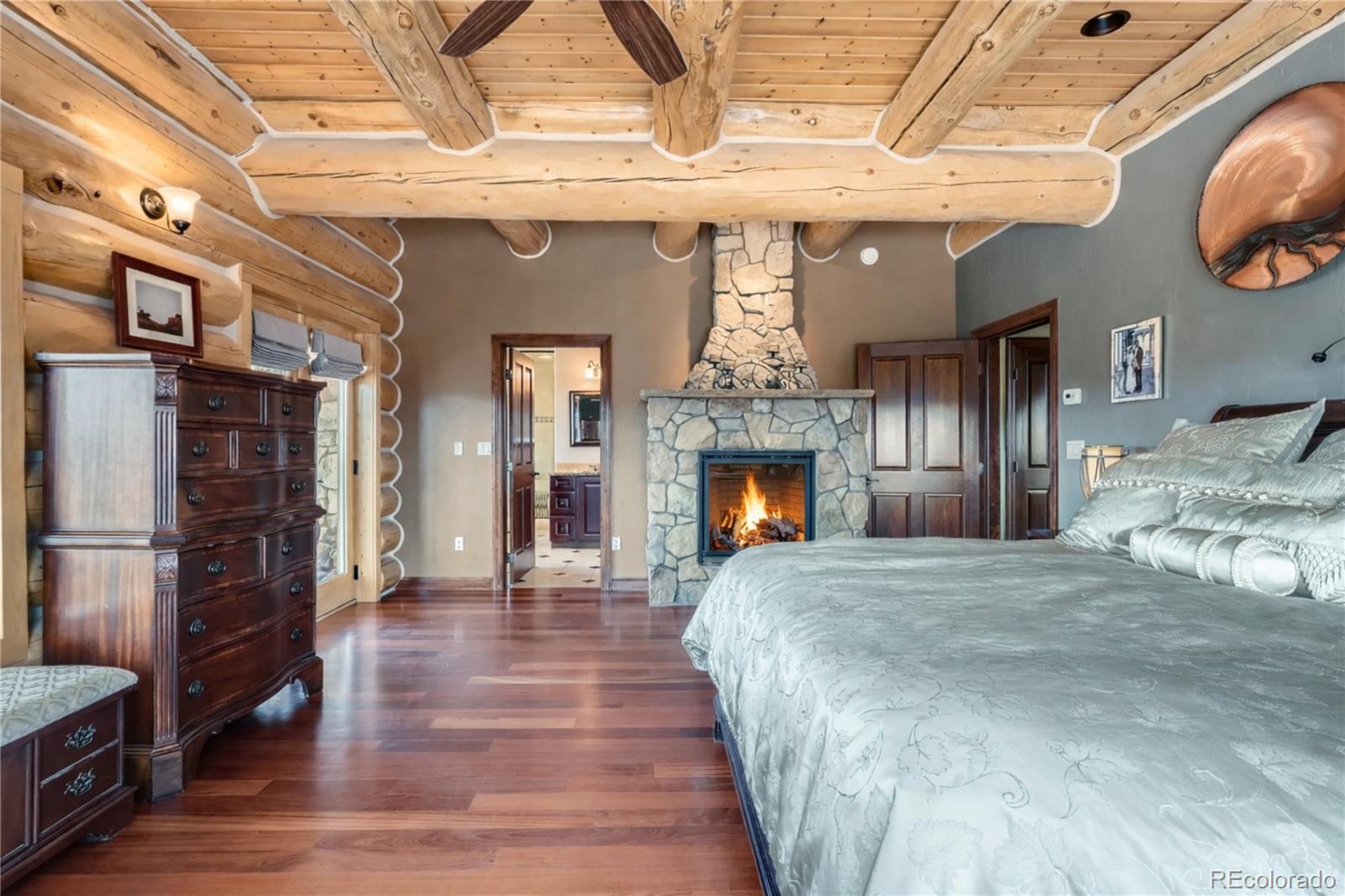401 Raptor Point Golden, CO 80403 - Photo 28 of 44 a view of an entryway with wooden floor and a fireplace
