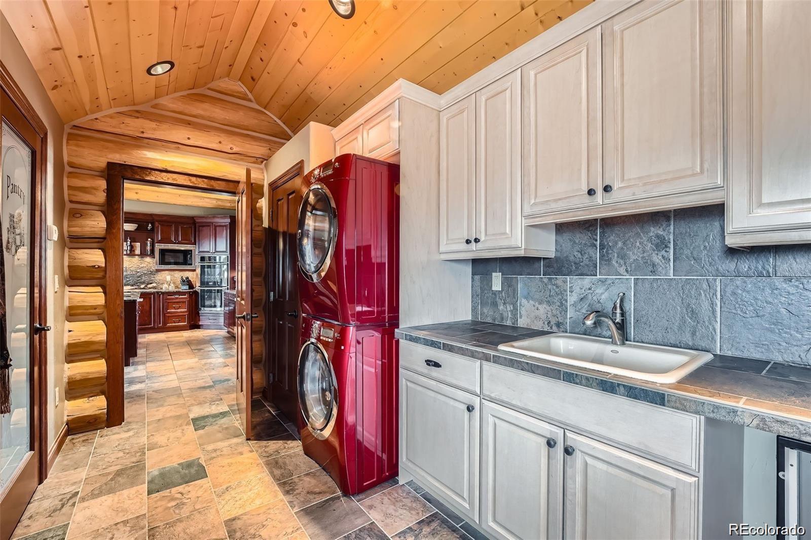 401 Raptor Point Golden, CO 80403 - Photo 30 of 44 a kitchen with a sink and cabinets