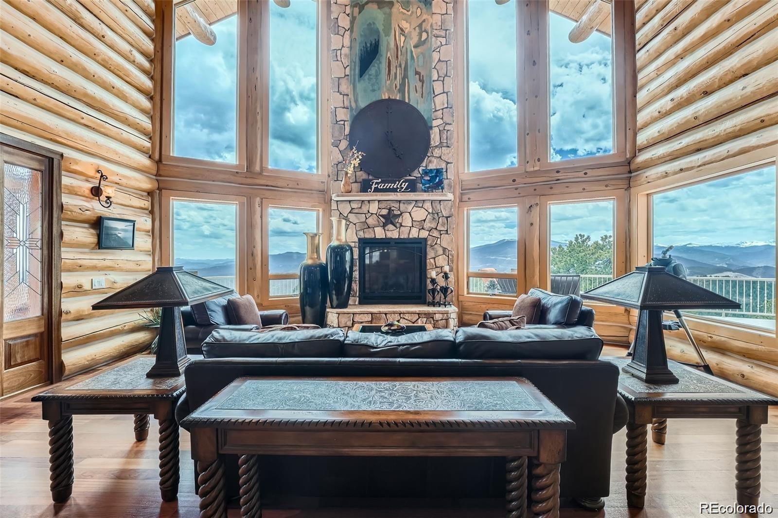 401 Raptor Point Golden, CO 80403 - Photo 3 of 44 a living room with fireplace furniture and a large window