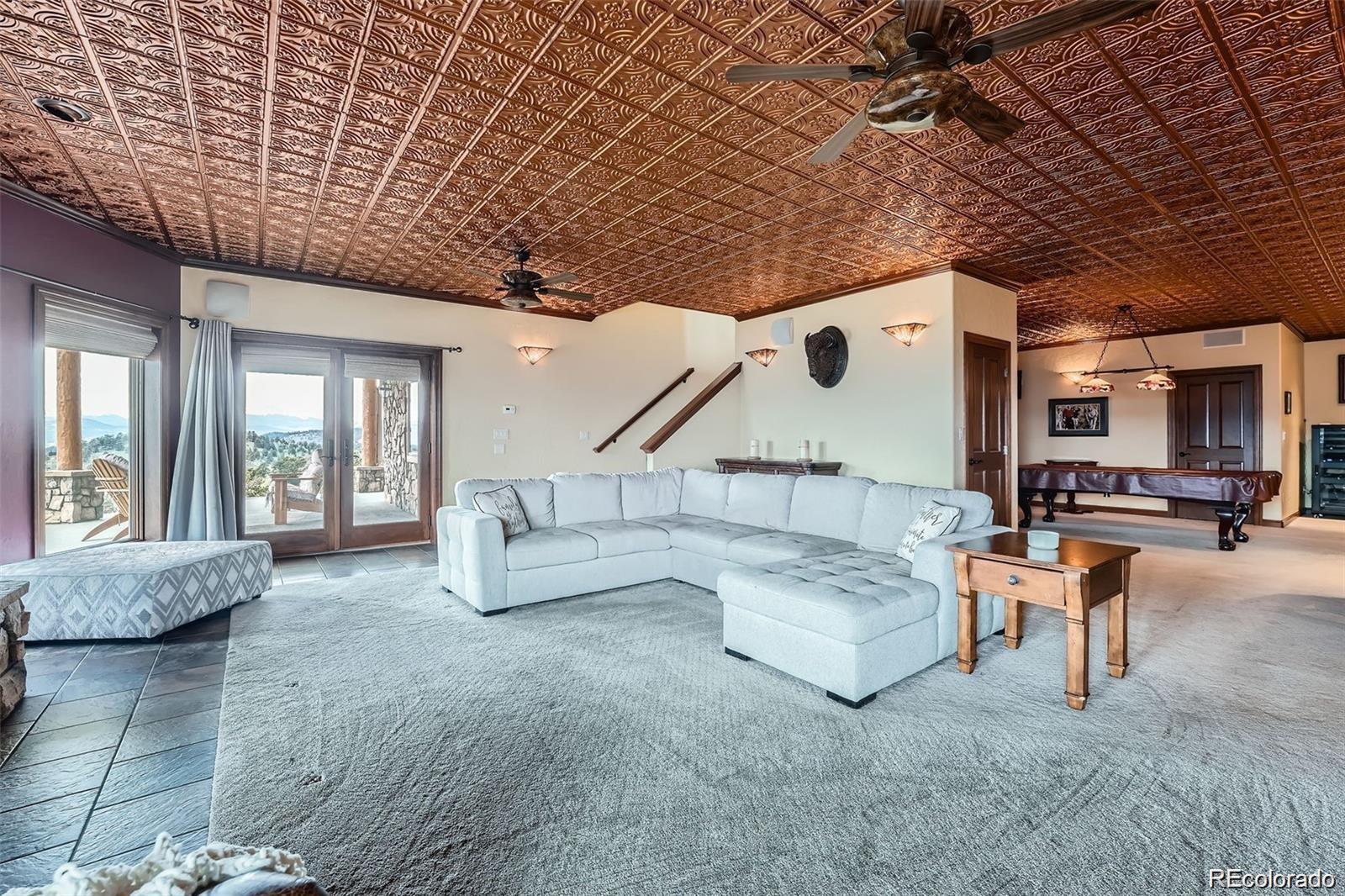 401 Raptor Point Golden, CO 80403 - Photo 34 of 44 a living room with furniture and a large window