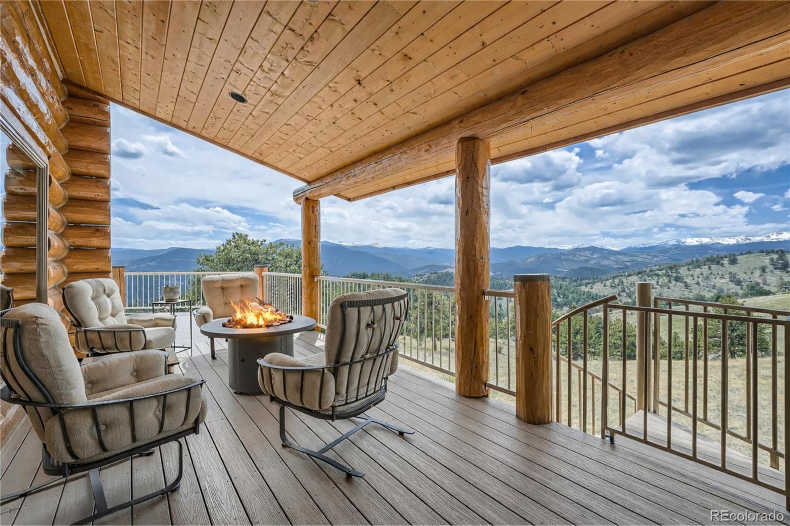401 Raptor Point Golden, CO 80403 - Photo 38 of 44 a patio with lawn chairs and wooden floor