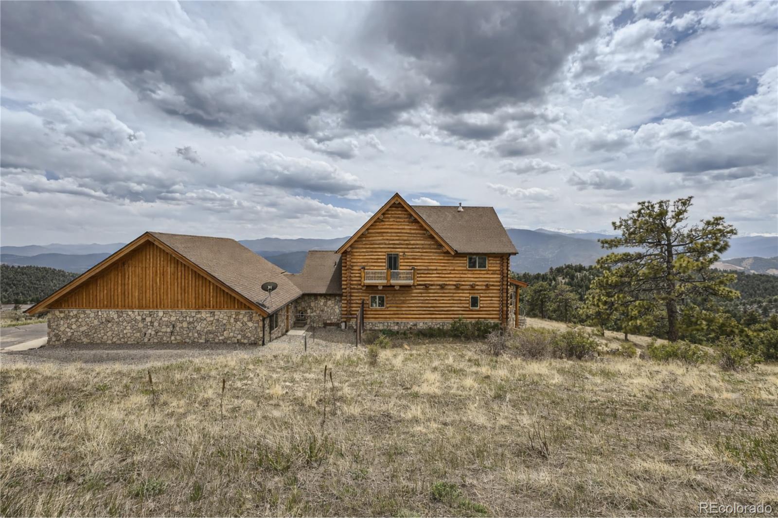 401 Raptor Point Golden, CO 80403 - Photo 42 of 44 a house with trees in front of it