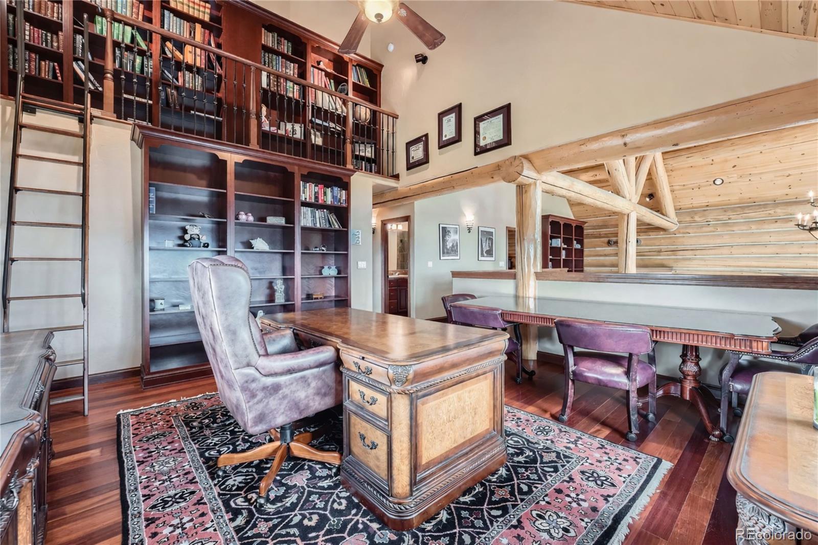401 Raptor Point Golden, CO 80403 - Photo 6 of 44 a living room with furniture a piano and a rug