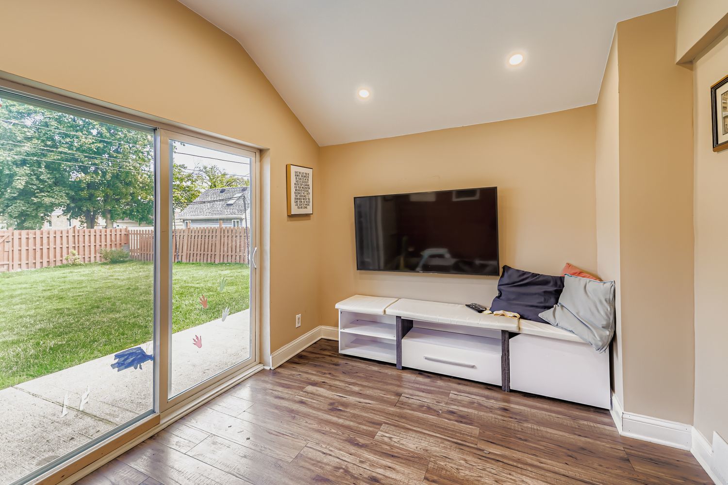 5346 Suffield Terrace Skokie, IL 60077 - Photo 13 of 27 a living room with furniture and a flat screen tv