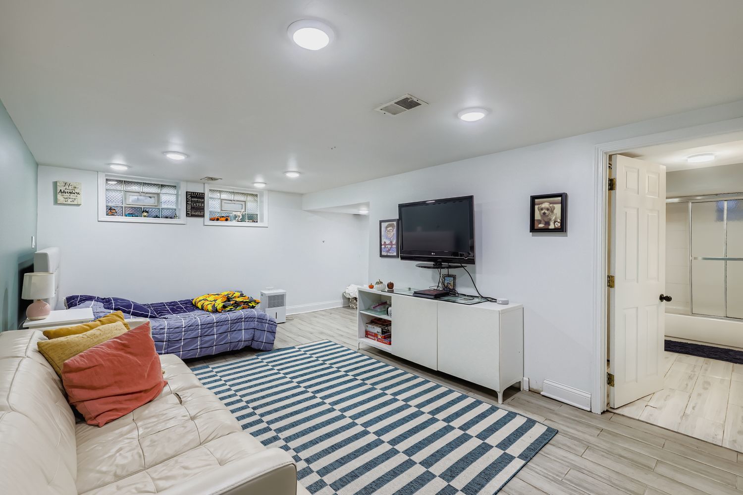 5346 Suffield Terrace Skokie, IL 60077 - Photo 22 of 27 a bedroom with furniture and a flat screen tv