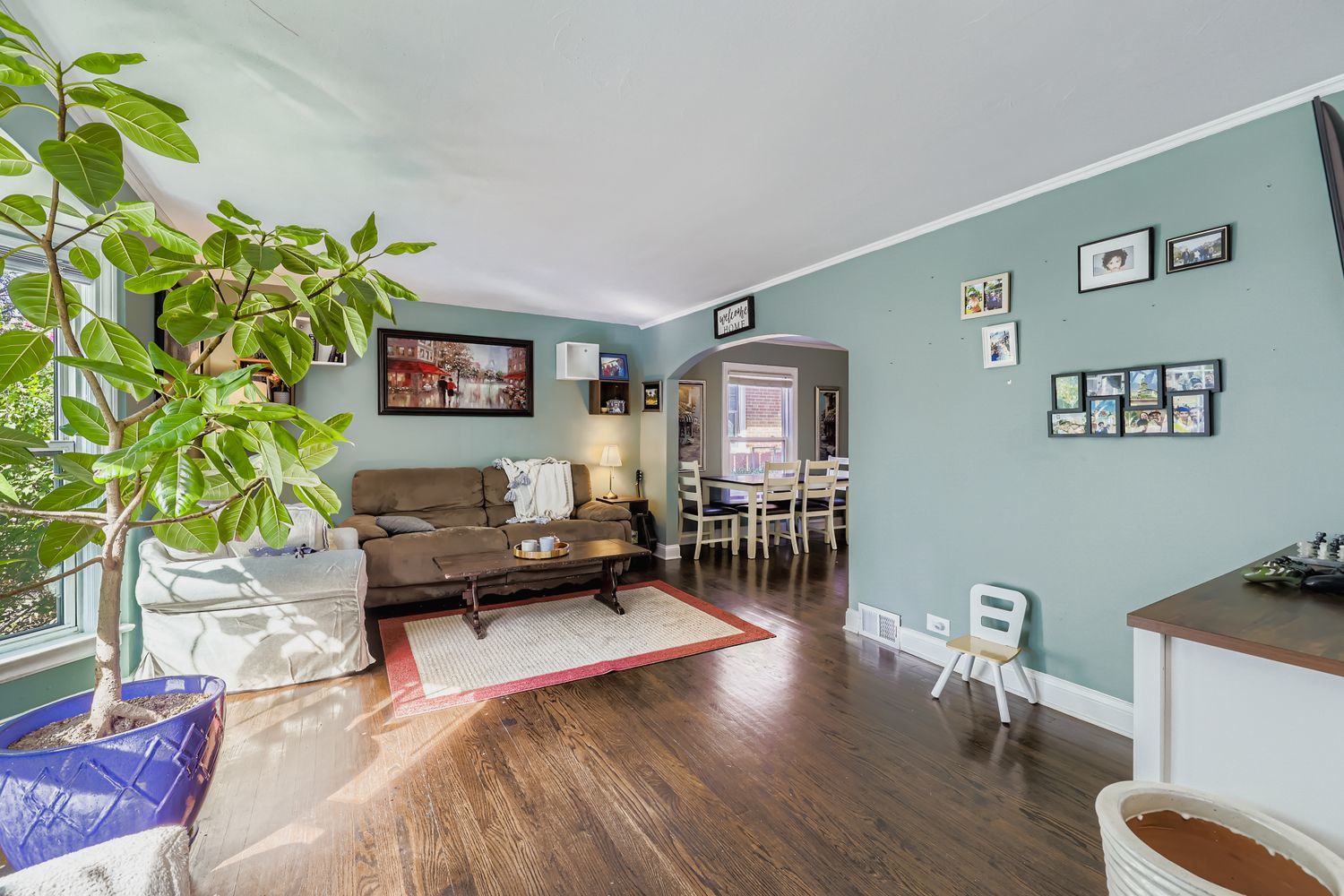 5346 Suffield Terrace Skokie, IL 60077 - Photo 3 of 27 a living room with furniture and a flat screen tv