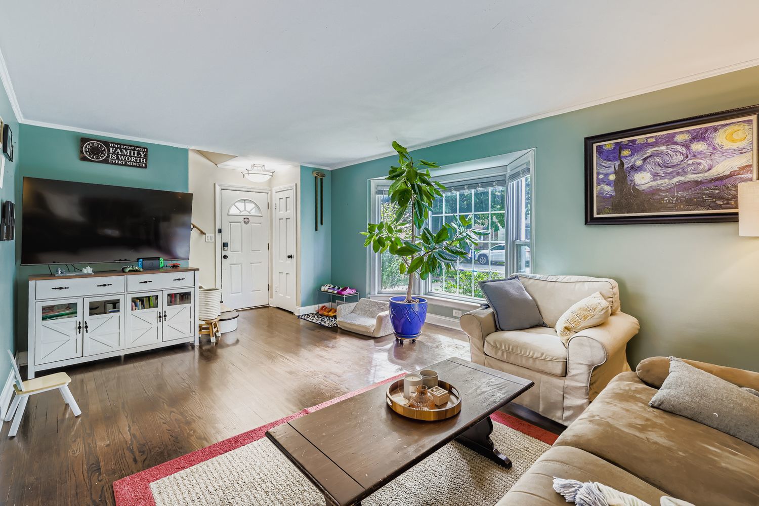 5346 Suffield Terrace Skokie, IL 60077 - Photo 5 of 27 a living room with furniture and a flat screen tv