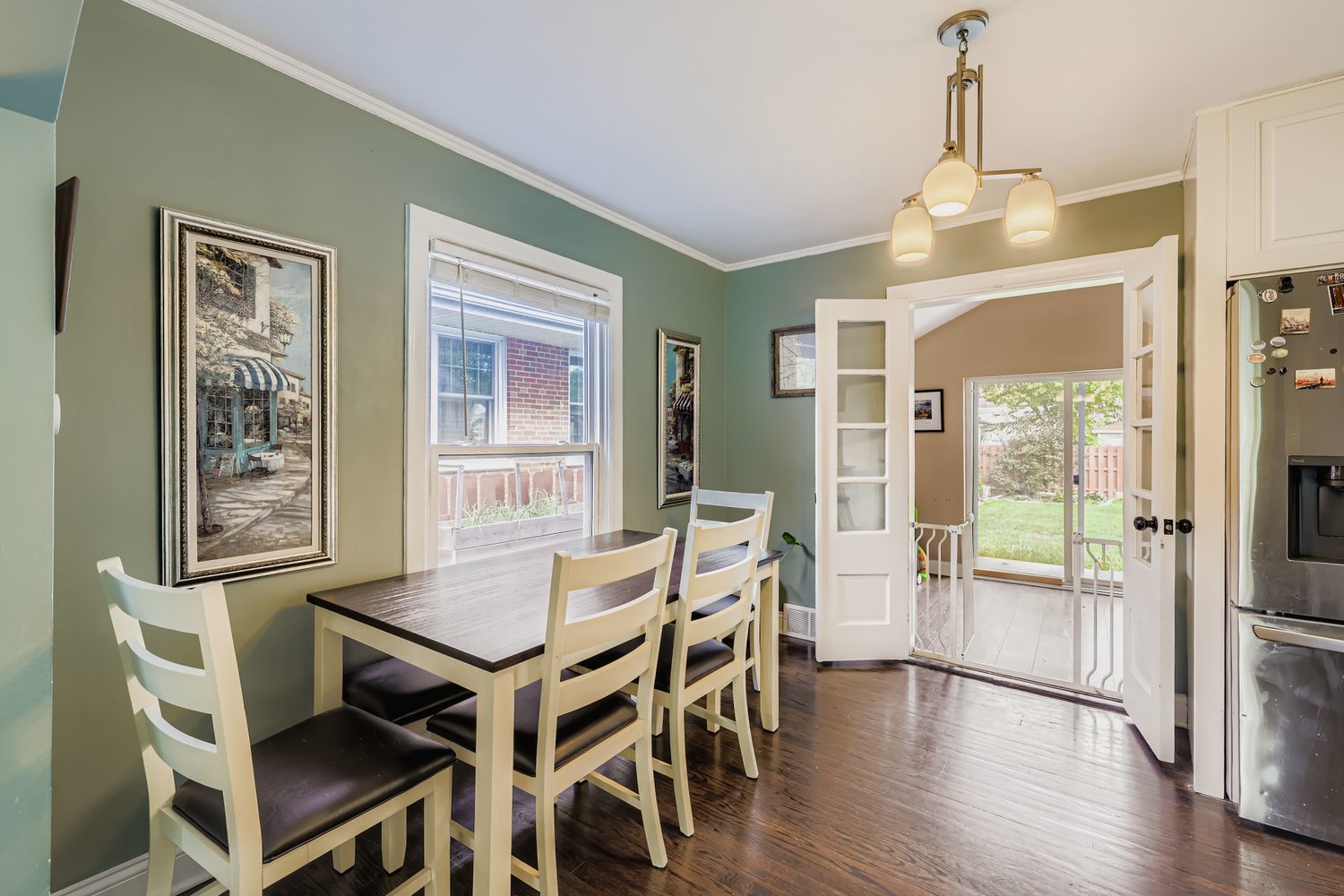 5346 Suffield Terrace Skokie, IL 60077 - Photo 7 of 27 a view of a dining room with furniture and wooden floor