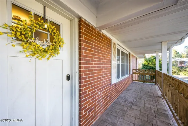 a view of a porch with wooden floor