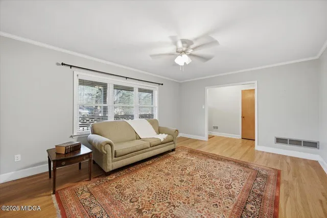 a living room with furniture and a rug