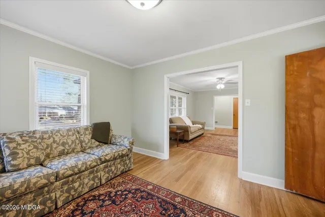 a bedroom with furniture and a window