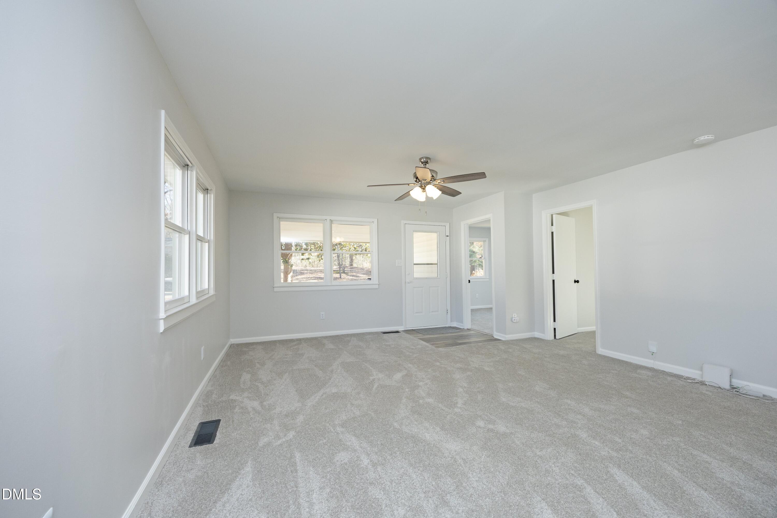 5108 Old Valley Street Raleigh, NC 27603 - Photo 10 of 37 an empty room with windows and ceiling fan