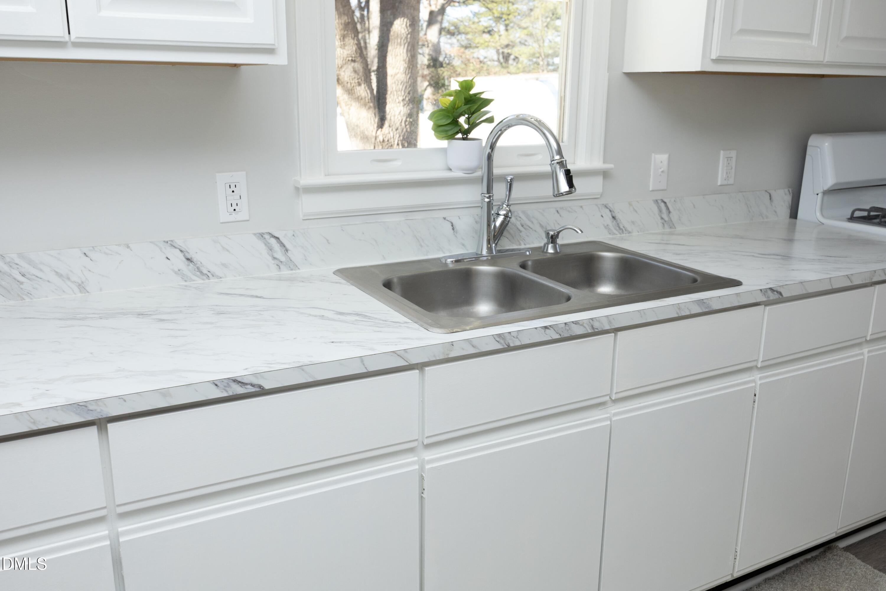 5108 Old Valley Street Raleigh, NC 27603 - Photo 15 of 37 a close view of sink and tap