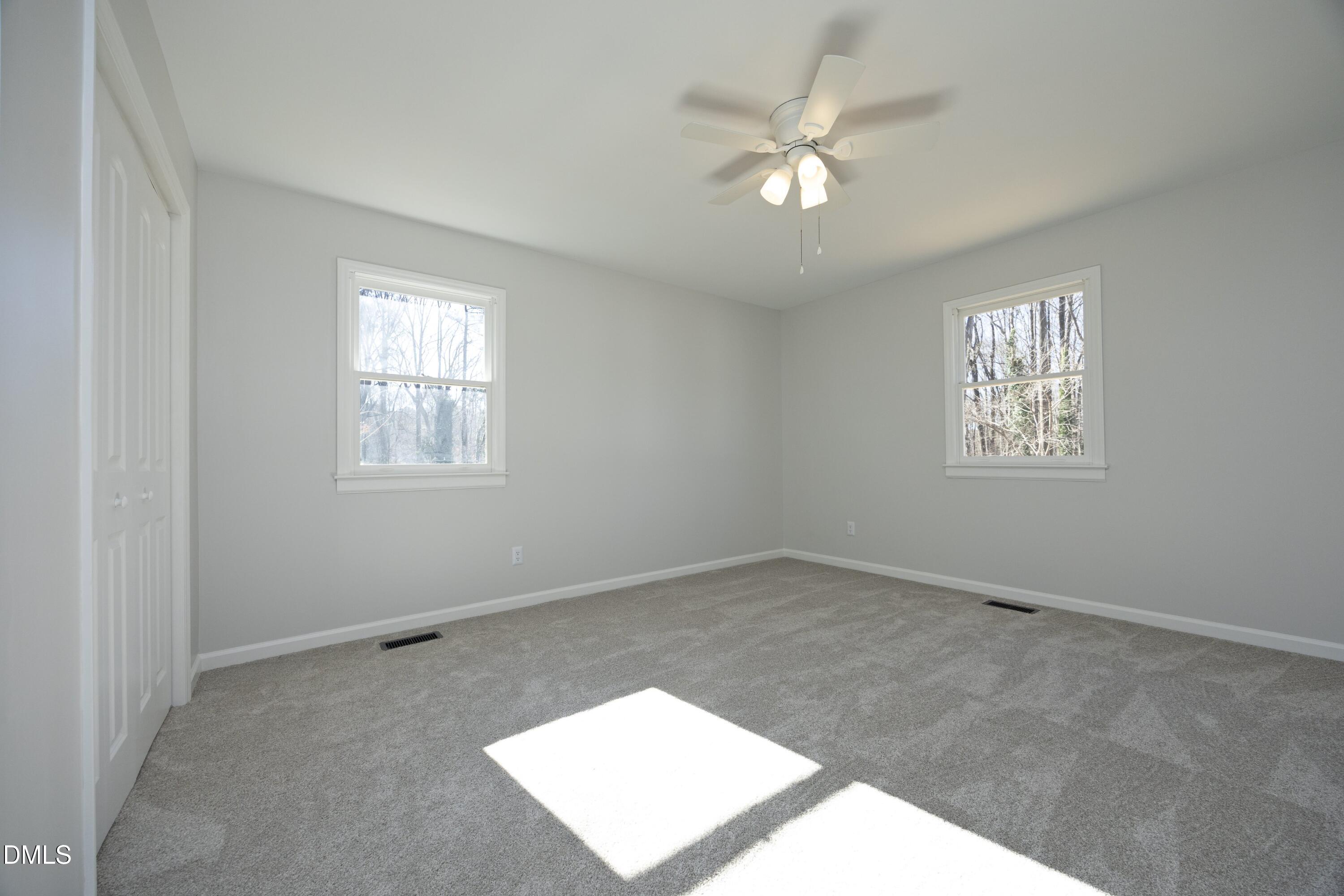 5108 Old Valley Street Raleigh, NC 27603 - Photo 16 of 37 an empty room with windows and fan
