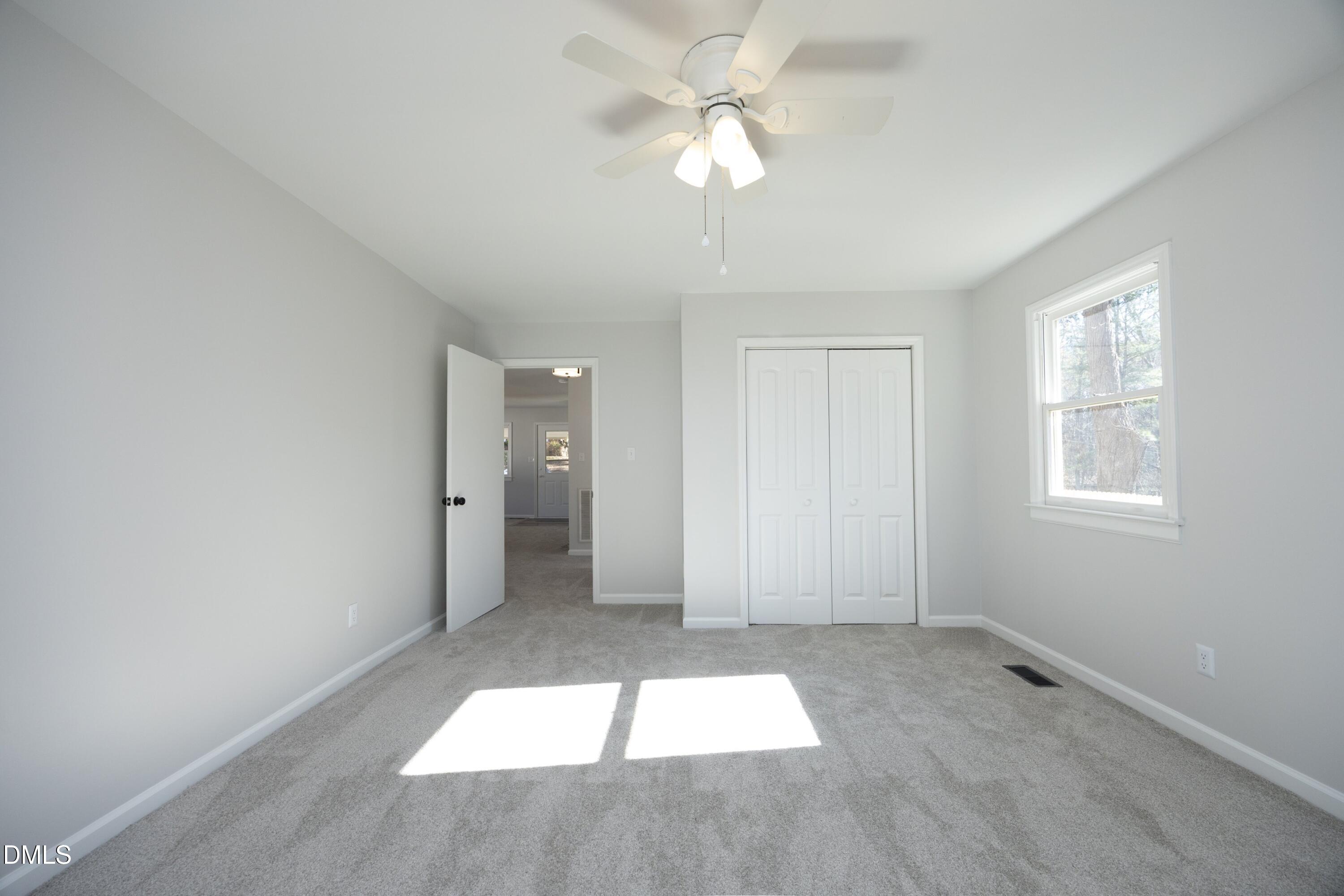 5108 Old Valley Street Raleigh, NC 27603 - Photo 17 of 37 wooden floor in an empty room with a window
