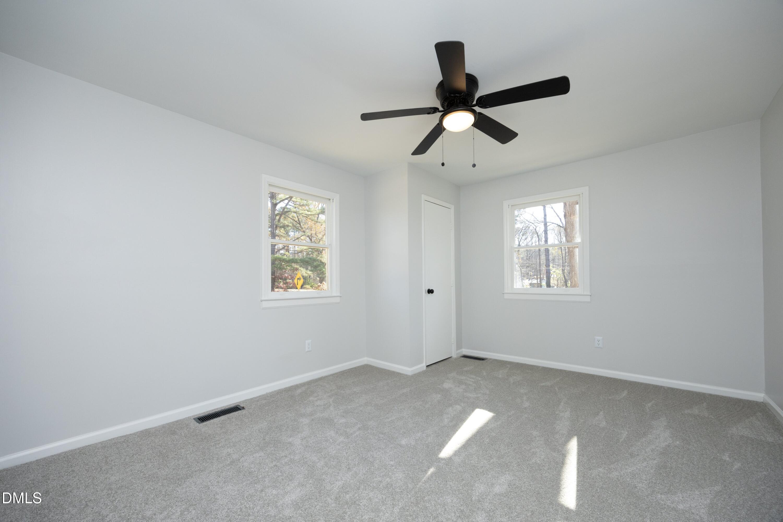 5108 Old Valley Street Raleigh, NC 27603 - Photo 21 of 37 a view of room with ceiling fan and window