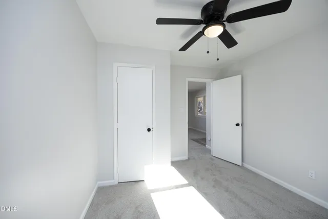 a kitchen with a refrigerator and a stove