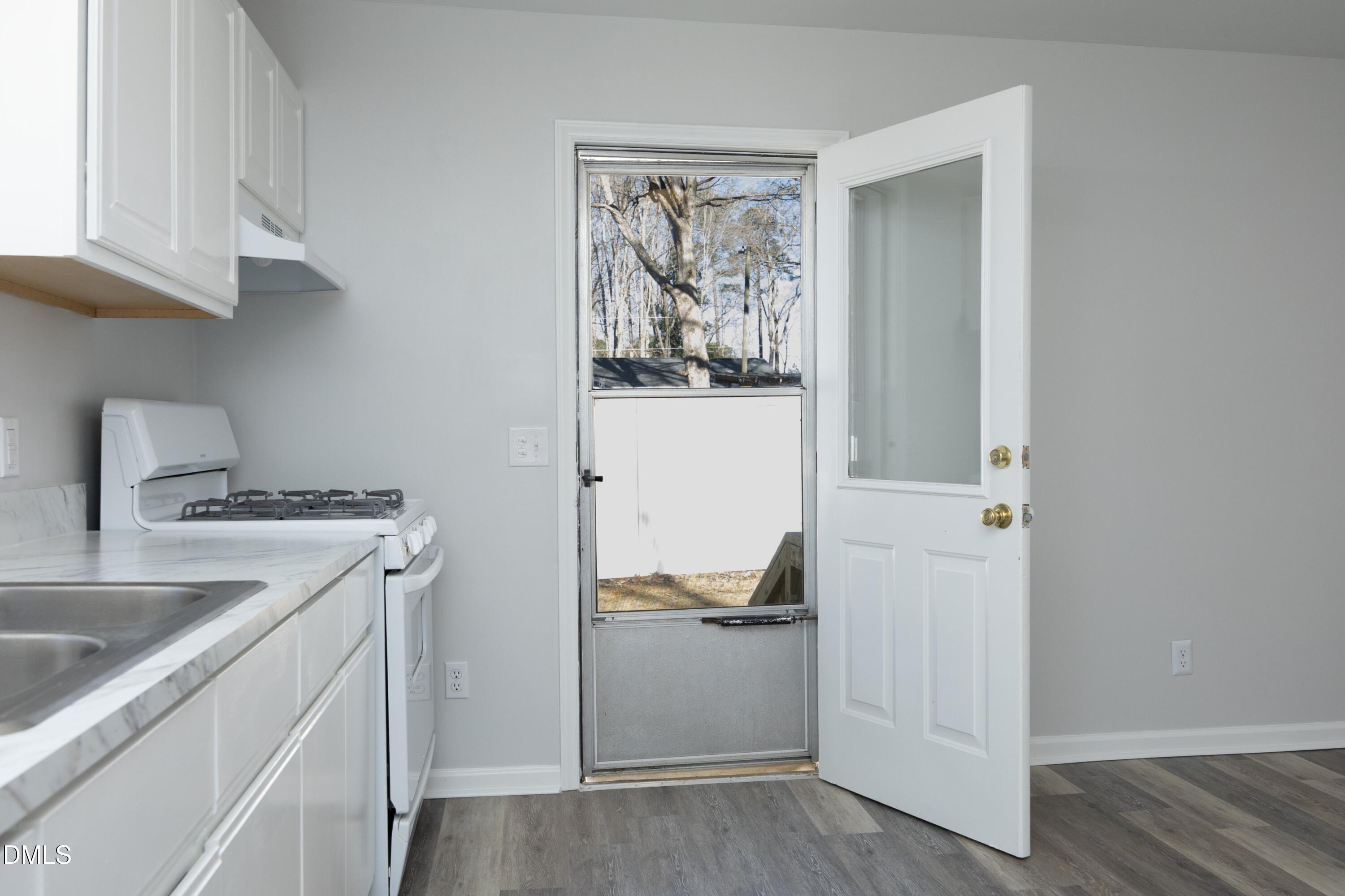 5108 Old Valley Street Raleigh, NC 27603 - Photo 25 of 37 a kitchen with a refrigerator and a stove