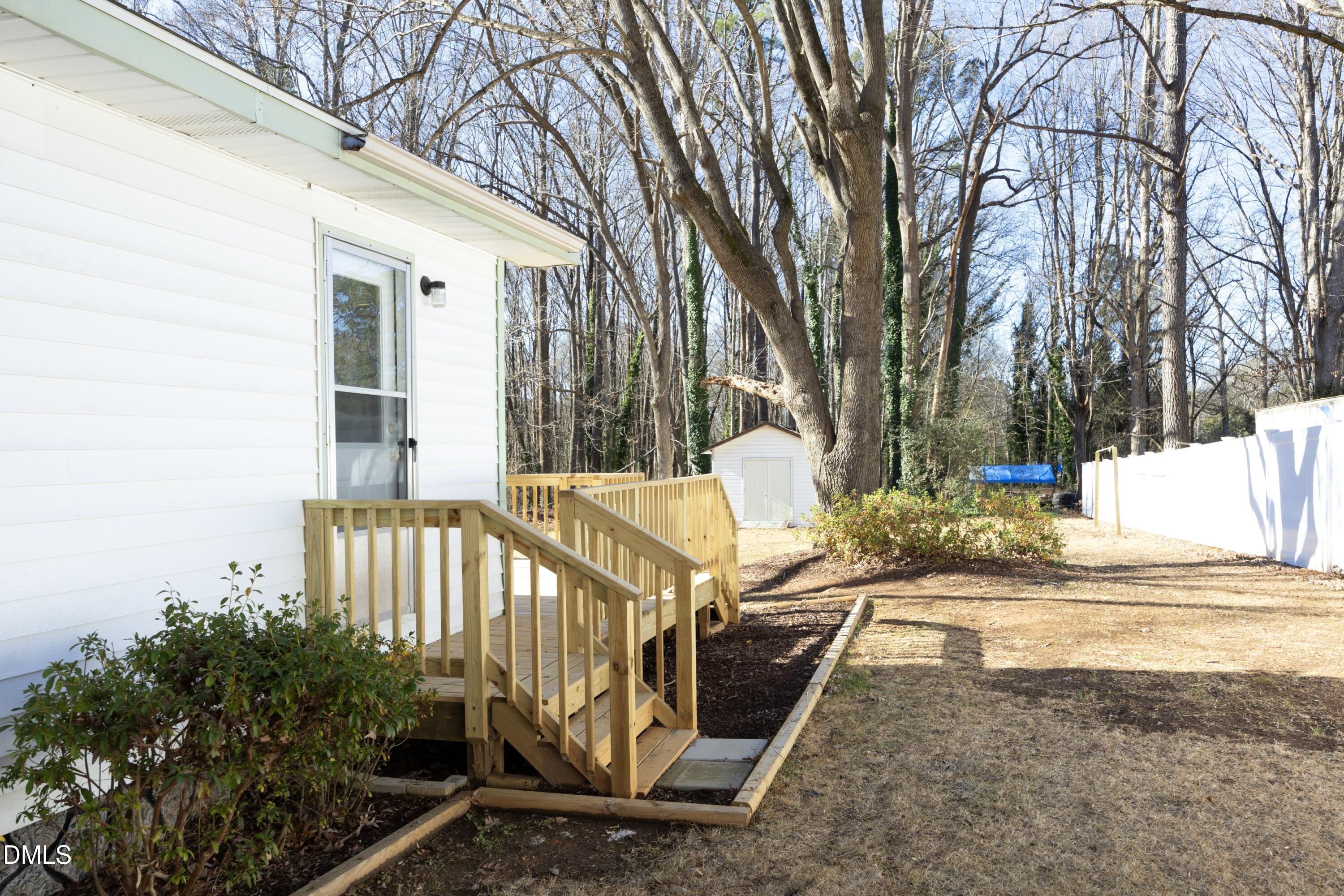 5108 Old Valley Street Raleigh, NC 27603 - Photo 26 of 37 a view of a yard with wooden fence