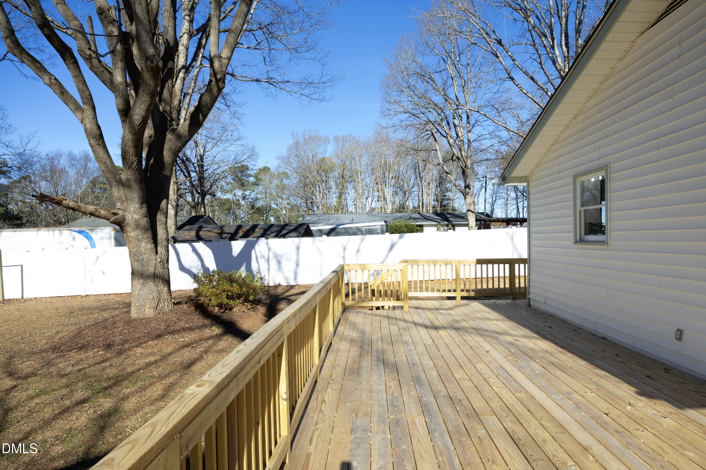 5108 Old Valley Street Raleigh, NC 27603 - Photo 28 of 37 a view of balcony with wooden floor and outdoor seating