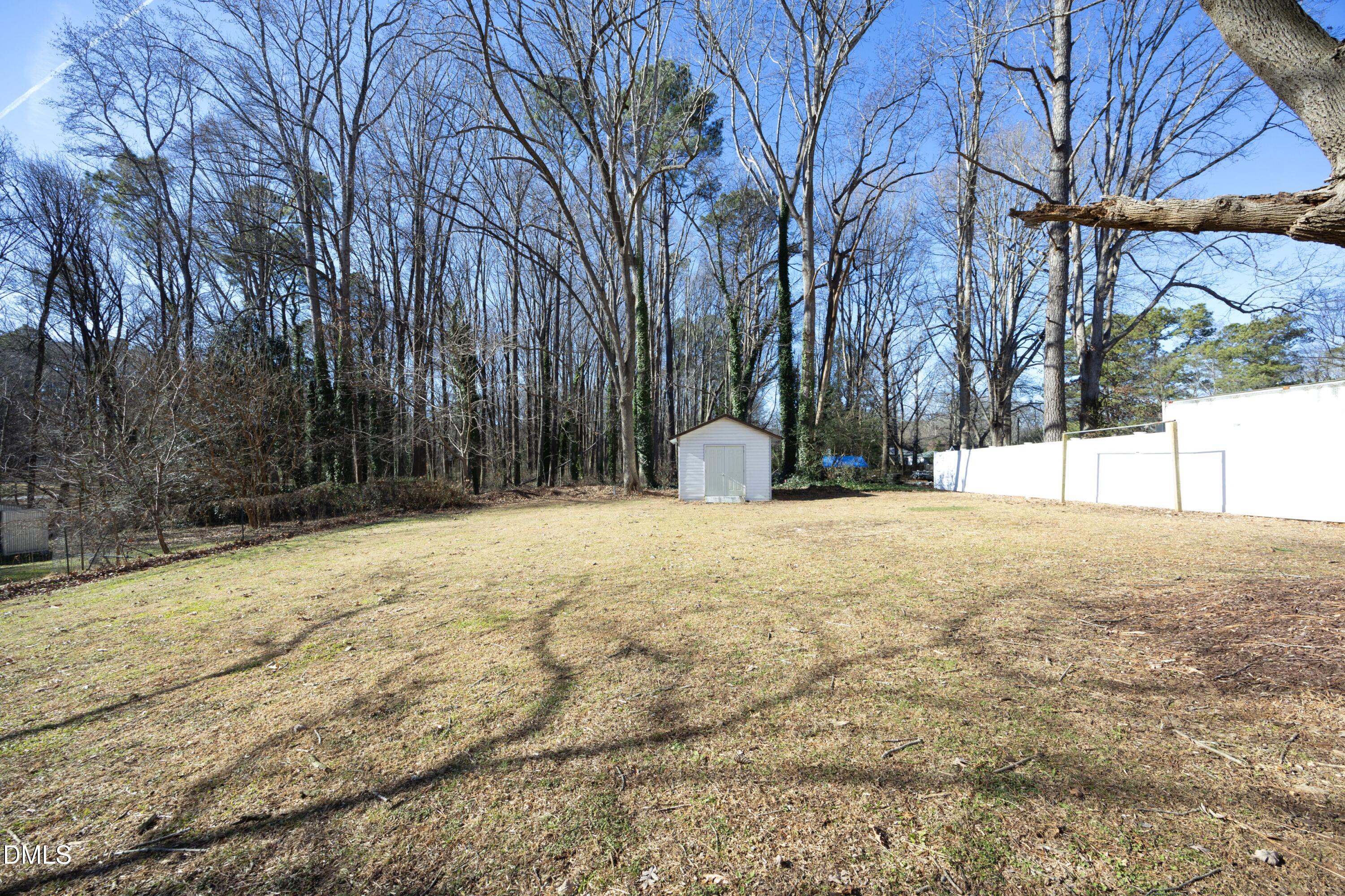5108 Old Valley Street Raleigh, NC 27603 - Photo 31 of 37 a view of large tree with a wooden fence