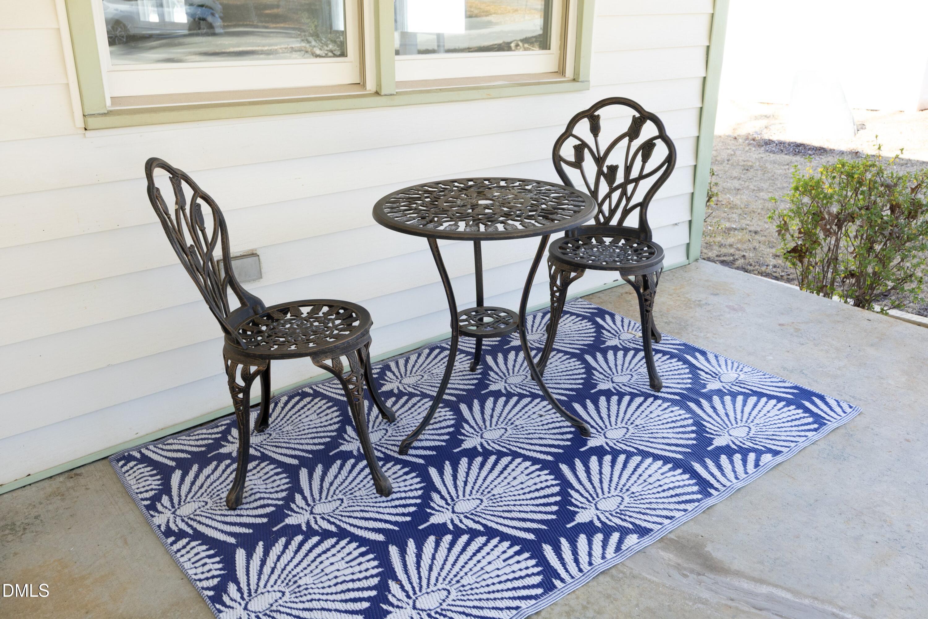 5108 Old Valley Street Raleigh, NC 27603 - Photo 6 of 37 a view of a table and chairs in patio