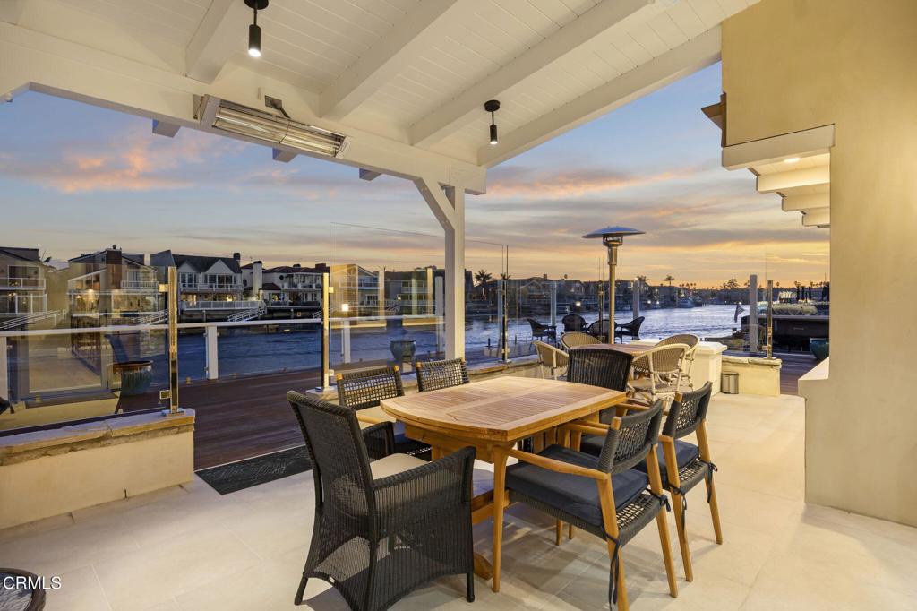 2131 Ravoli Drive Oxnard, CA 93035 - Photo 22 of 53 a dining area with a table and chairs
