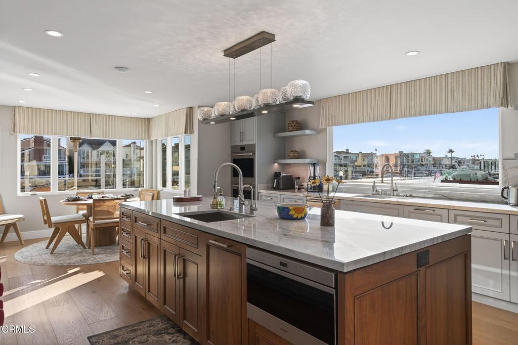 2131 Ravoli Drive Oxnard, CA 93035 - Photo 26 of 53 a kitchen with stainless steel appliances granite countertop a sink and a large window