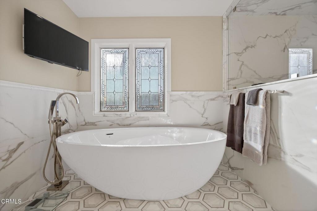 2131 Ravoli Drive Oxnard, CA 93035 - Photo 37 of 53 a white bath tub sitting in a bathroom