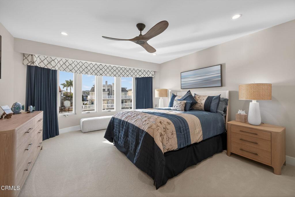 2131 Ravoli Drive Oxnard, CA 93035 - Photo 40 of 53 a spacious bedroom with a large bed and a chandelier
