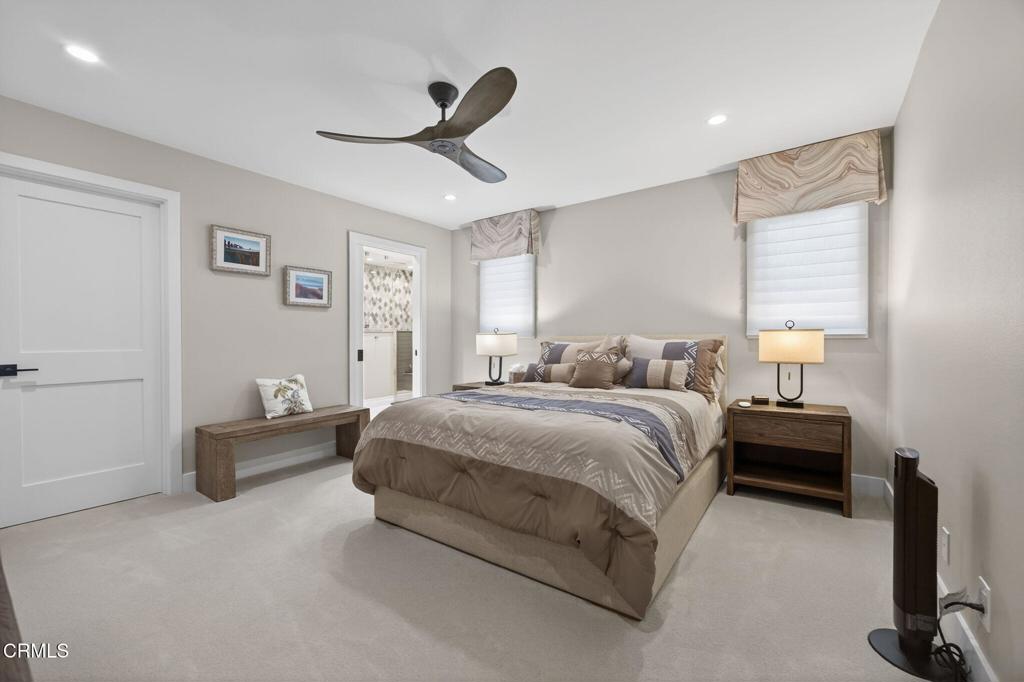2131 Ravoli Drive Oxnard, CA 93035 - Photo 43 of 53 a spacious bedroom with a bed and a chandelier