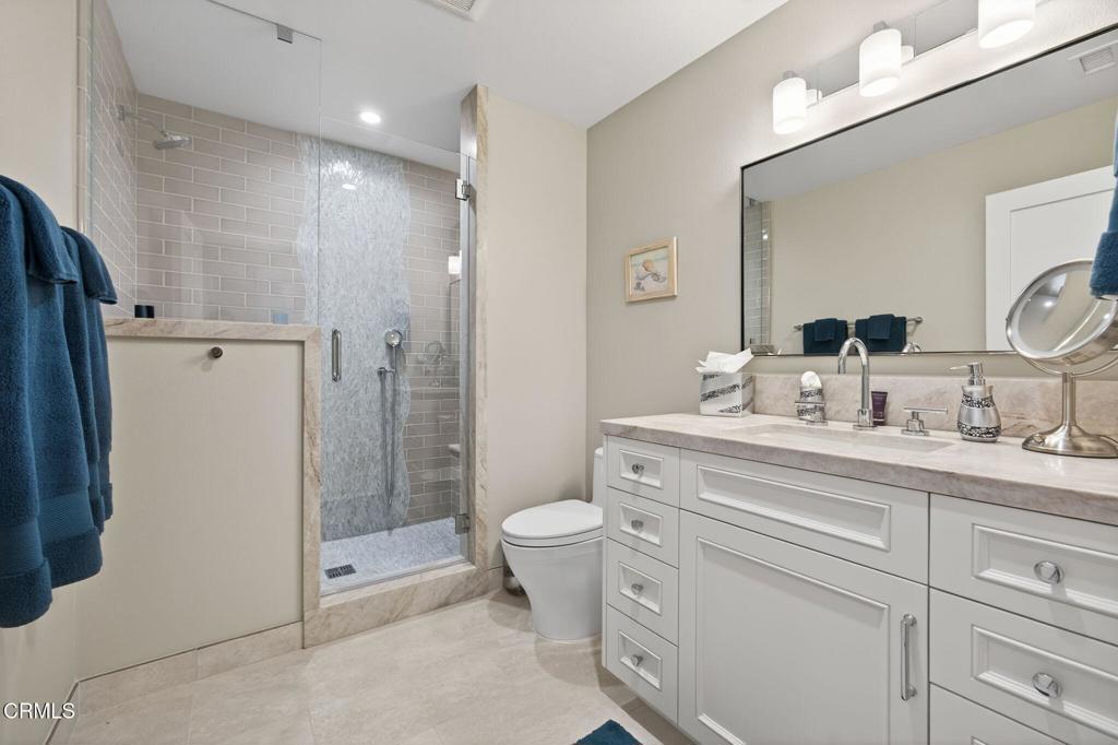 2131 Ravoli Drive Oxnard, CA 93035 - Photo 46 of 53 a bathroom with a double vanity sink toilet and shower