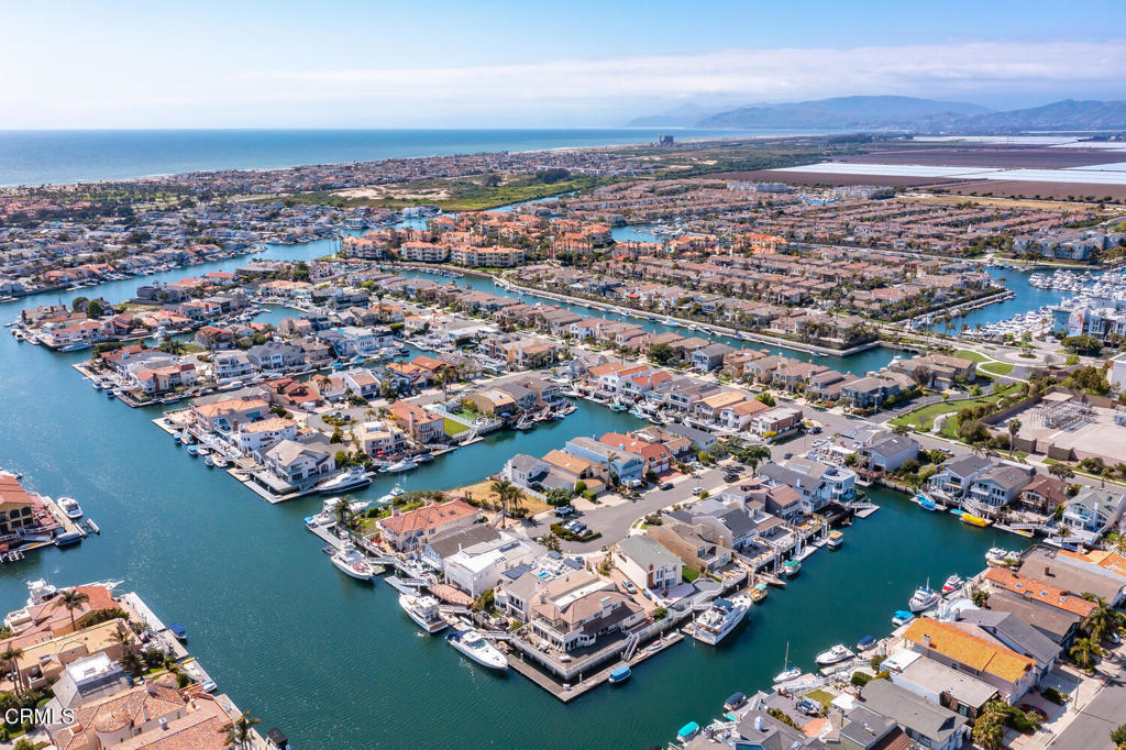 2131 Ravoli Drive Oxnard, CA 93035 - Photo 48 of 53 an aerial view of a city with lots of residential buildings ocean and mountain view in back
