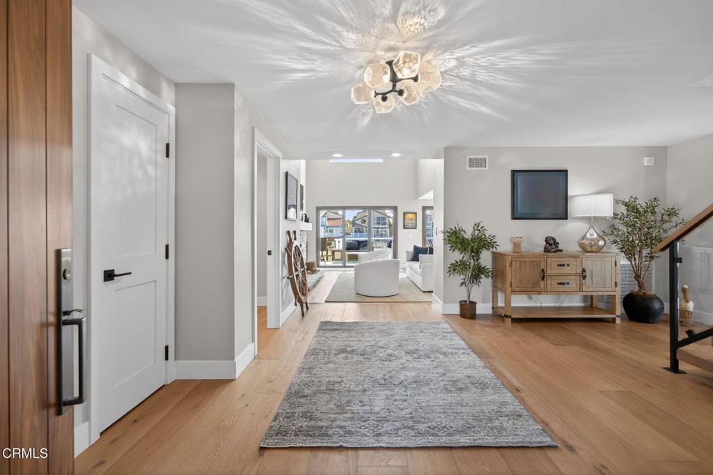 2131 Ravoli Drive Oxnard, CA 93035 - Photo 7 of 53 a view of a living room and a livingroom with furniture a chandelier
