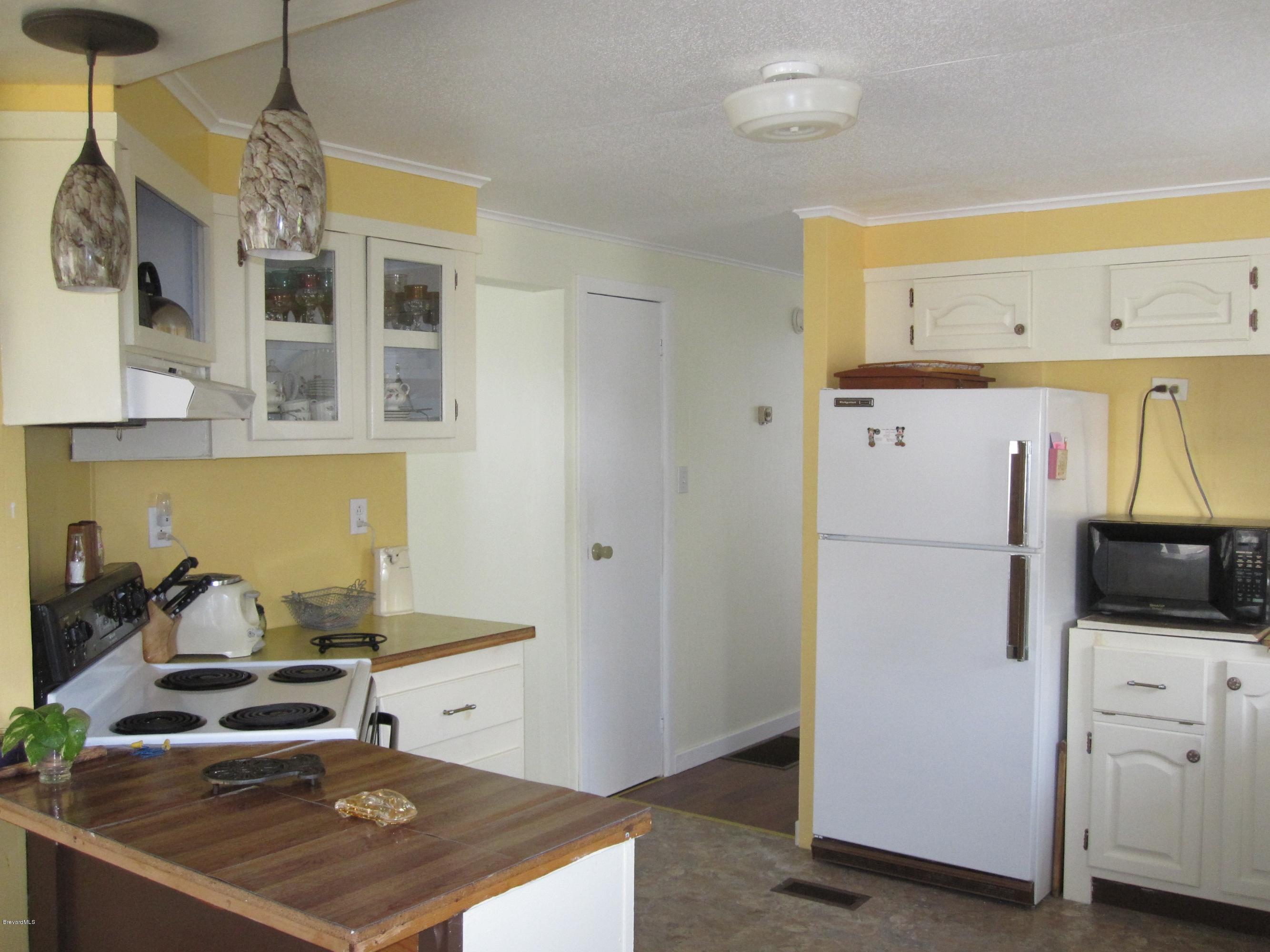 3074 Dover Road Mims, FL 32754 - Photo 12 of 27 Kitchen and Hallway to Bedrooms