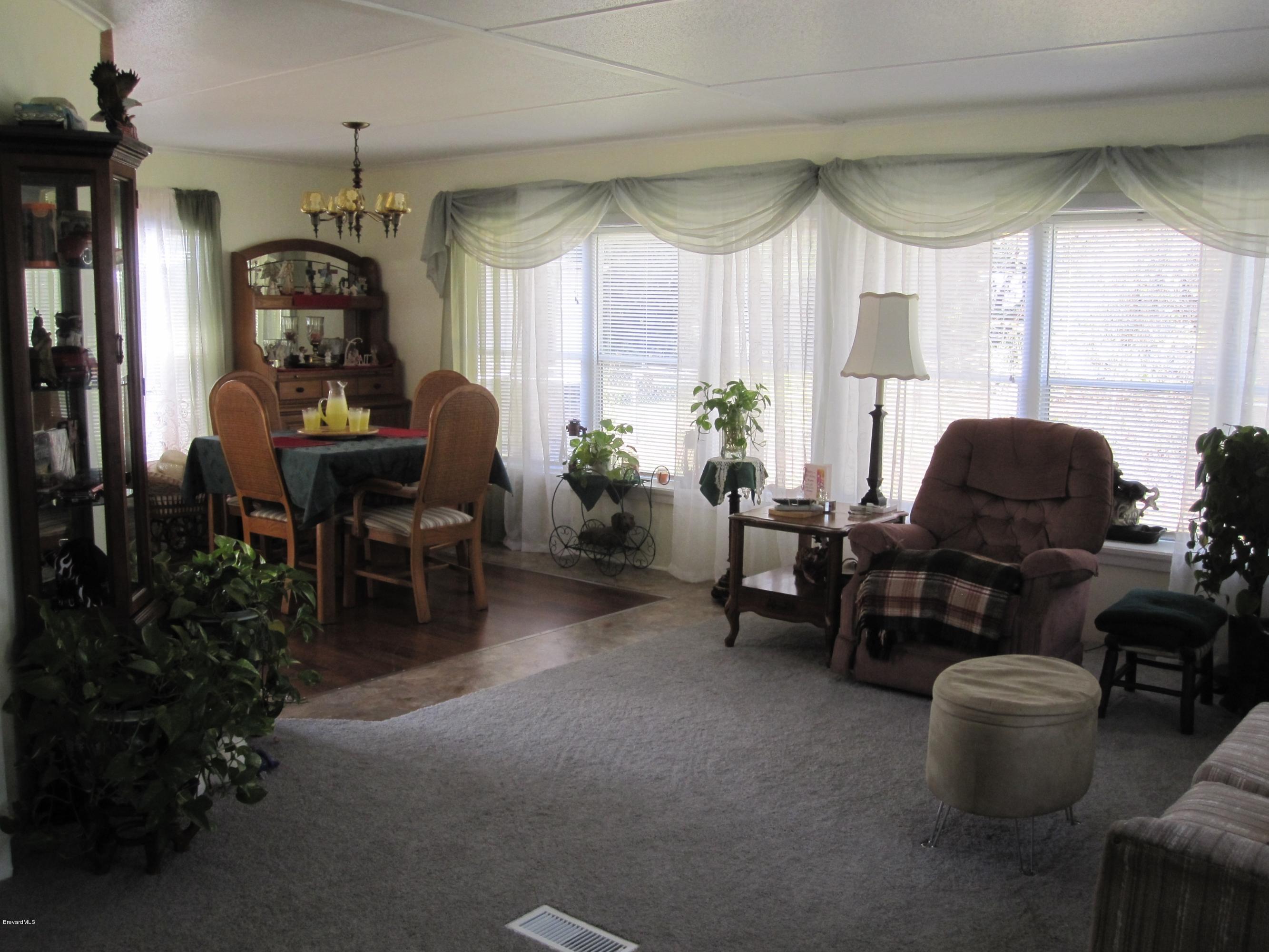 3074 Dover Road Mims, FL 32754 - Photo 7 of 27 Family Room opens to Dining Area