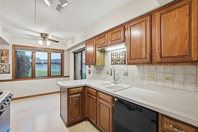 a spacious bathroom with a granite countertop sink and a large mirror