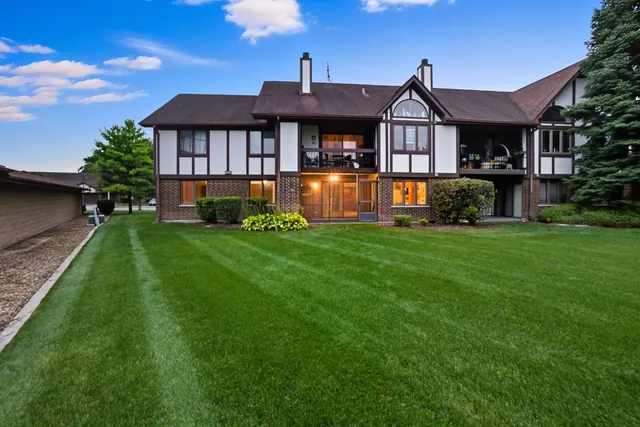 an aerial view of residential houses with outdoor space and river