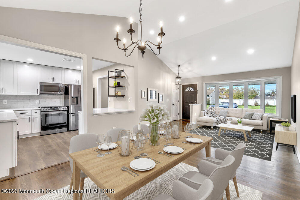 28 Maplecrest Drive Neptune Township, NJ 07753 - Photo 2 of 20 a open dining room with furniture a chandelier and kitchen view