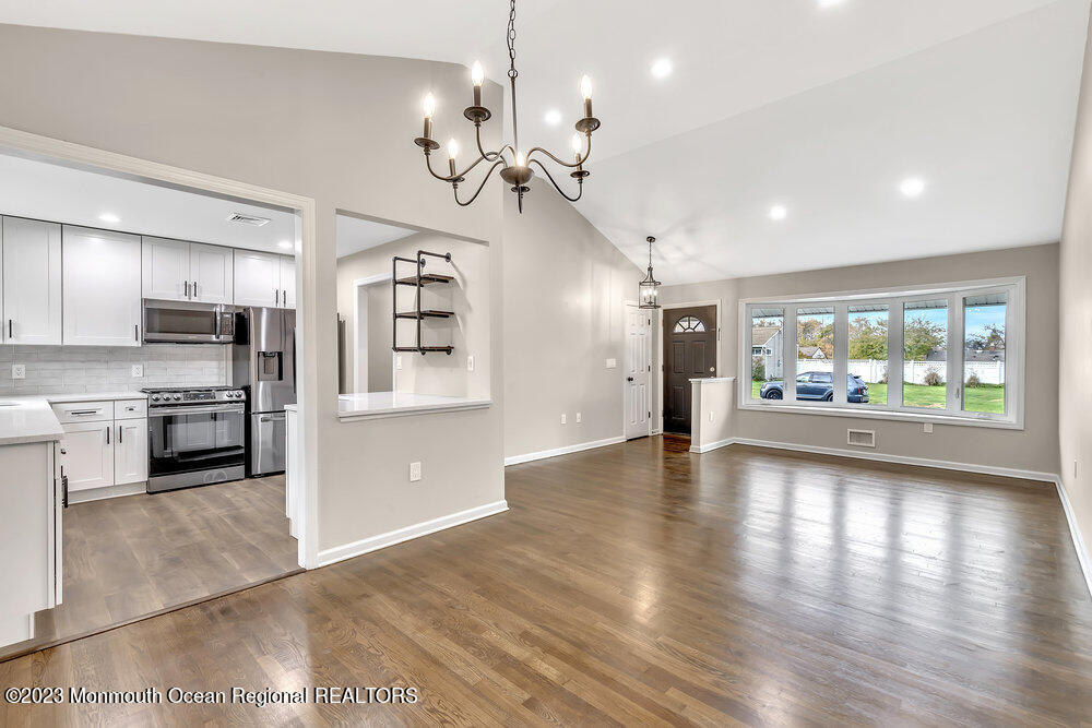 28 Maplecrest Drive Neptune Township, NJ 07753 - Photo 3 of 20 a view of a kitchen center island wooden floor and stainless steel appliances