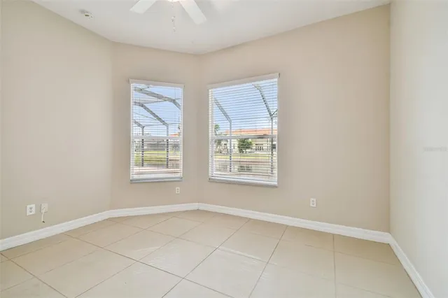 a bathroom with a granite countertop sink mirror and a toilet