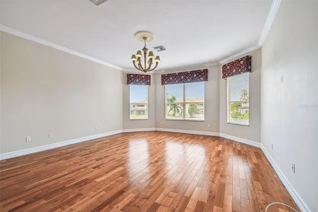 an aerial view of residential houses with outdoor space and river view